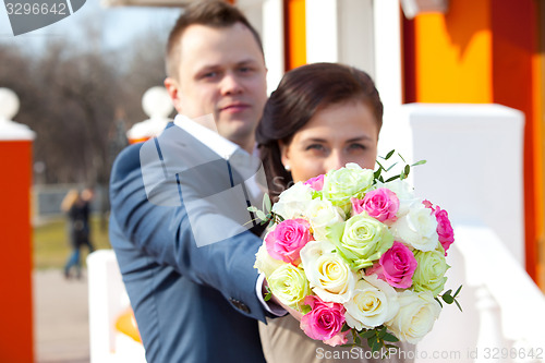 Image of bride and groom with bouquet