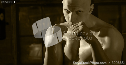 Image of kickboxer portrait with his fists