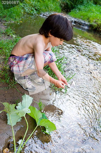 Image of boy near the stream