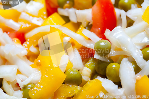 Image of salad with bell peppers, cabbage, tomatoes and green peas