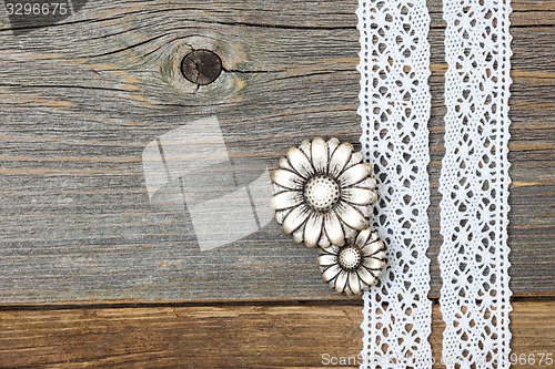 Image of vintage metal buttons flowers and lace ribbons