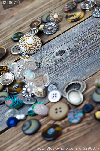 Image of placer of vintage buttons on aged boards