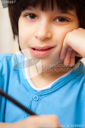 Image of boy portrait with pen