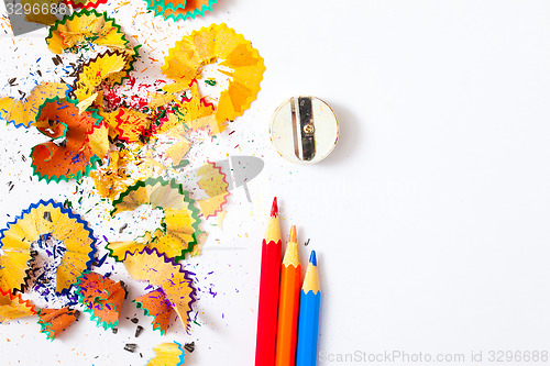 Image of varicolored pencil, shavings and sharpener