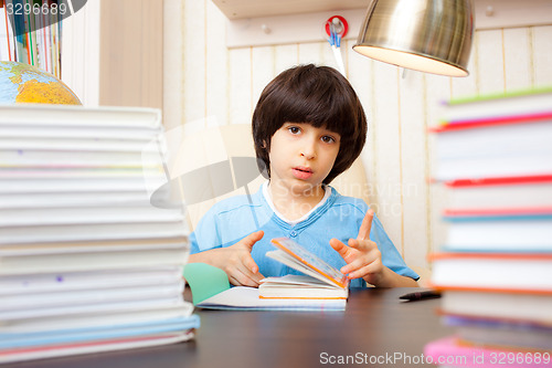 Image of child reading a book