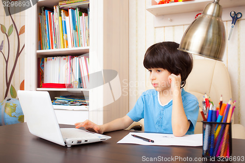 Image of boy doing homework, portrait