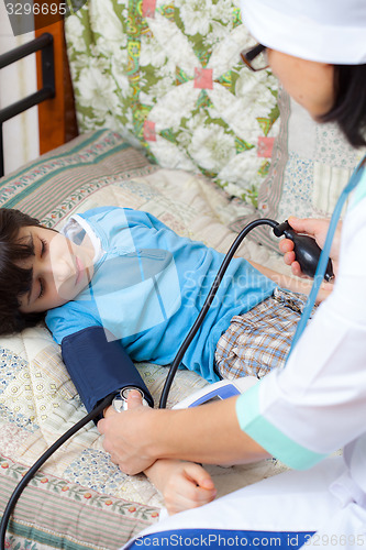 Image of Doctor pediatrician measure blood pressure