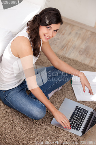 Image of Young girl using a laptop