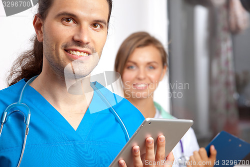 Image of Two young happy medical people