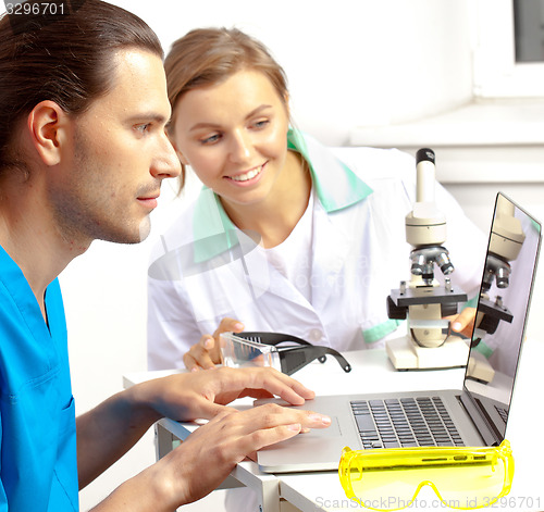 Image of two researchers in the laboratory