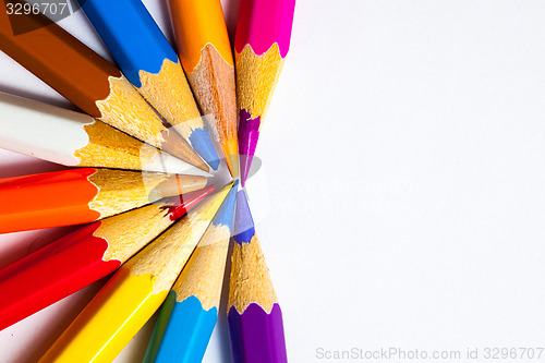 Image of varicolored pencils on white background