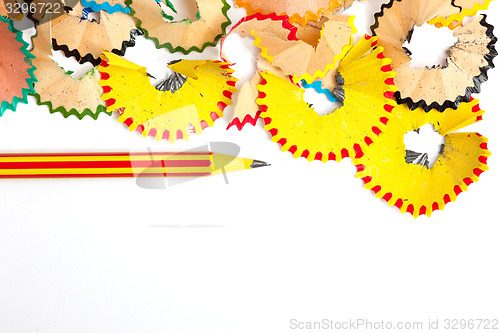 Image of striped pencil for drawing and shavings