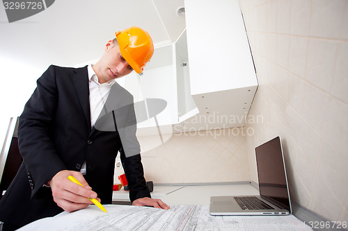 Image of engineer working with documents