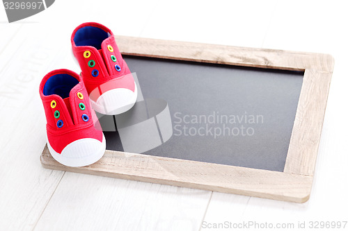 Image of frame and baby shoes