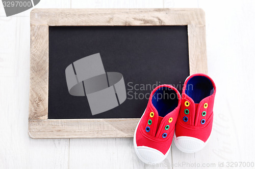 Image of frame and baby shoes