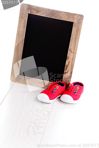 Image of frame and baby shoes