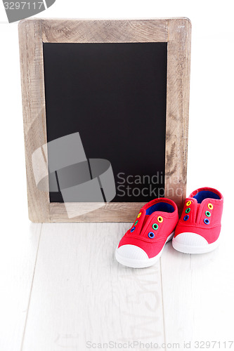 Image of frame and baby shoes