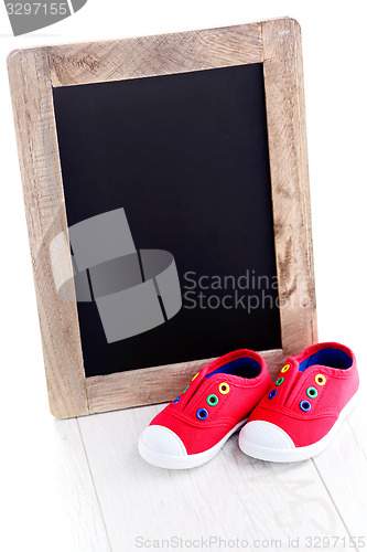 Image of frame and baby shoes