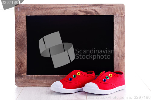 Image of frame and baby shoes