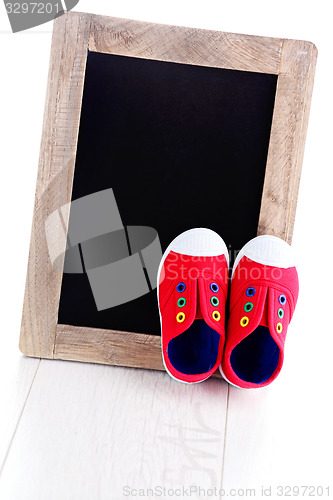 Image of frame and baby shoes