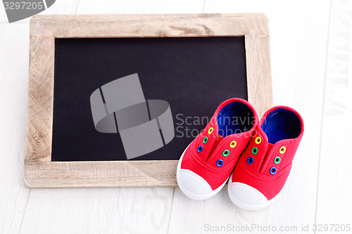 Image of frame and baby shoes