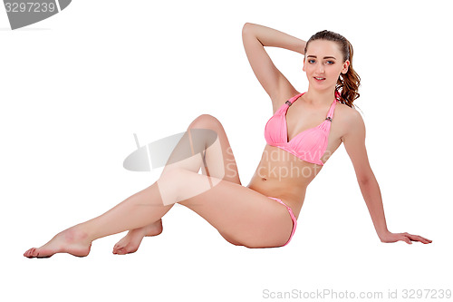 Image of Beautiful young woman in pink swimwear