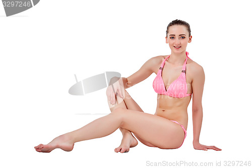 Image of Beautiful young woman in pink swimwear
