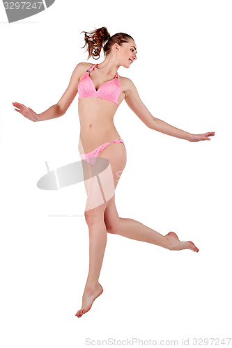 Image of Beautiful young woman in pink swimwear