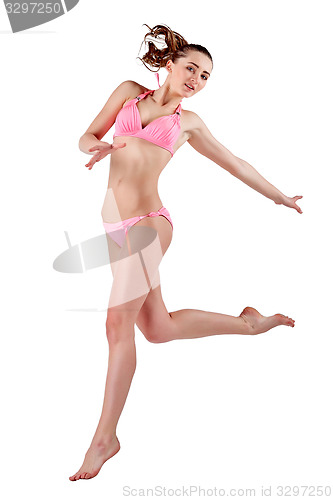 Image of Beautiful young woman in pink swimwear
