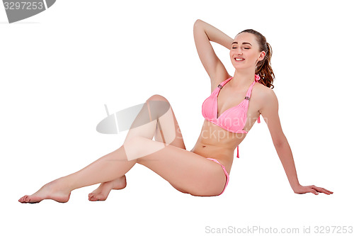 Image of Beautiful young woman in pink swimwear