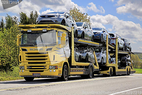 Image of Yellow Scania R500 Car Carrier Hauls New Cars