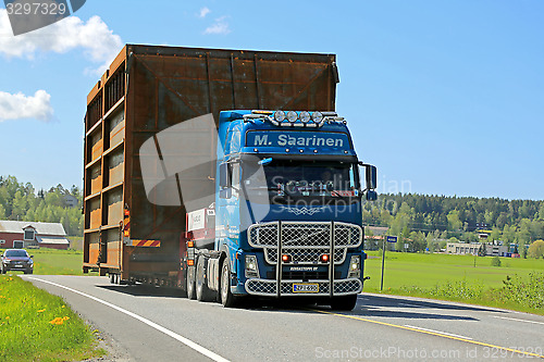 Image of Volvo FH Hauls Wide Load along Highway