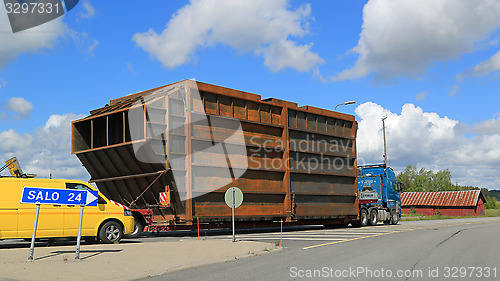 Image of Exceptional Load Led by Pilot Car in a Roundabout