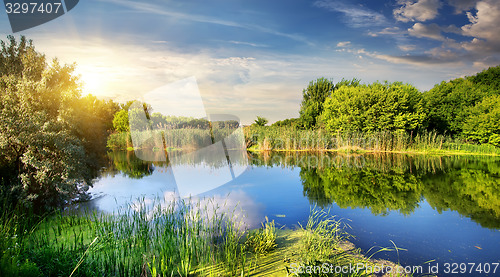 Image of Evening sun over river