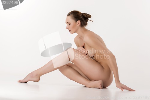 Image of Beautiful caucasian naked woman sitting with fresh clean skin