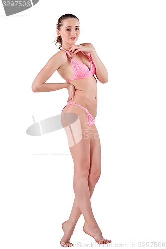 Image of Beautiful young woman in pink swimwear