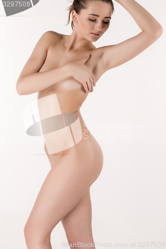 Image of Slim young beautiful girl on the white background