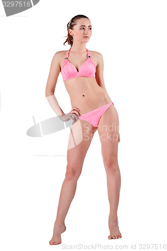 Image of Beautiful young woman in pink swimwear