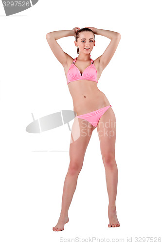 Image of Beautiful young woman in pink swimwear