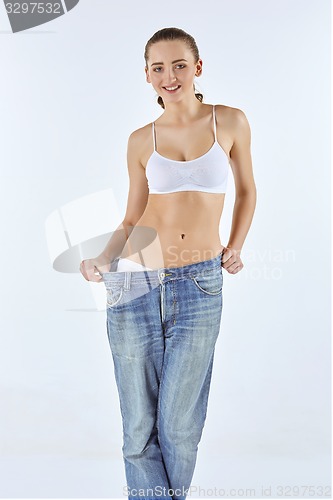 Image of Woman became skinny and wearing old jeans