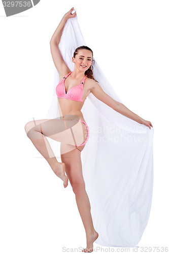 Image of Beautiful young woman in pink swimwear