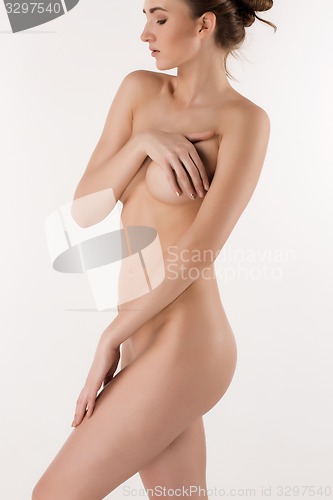 Image of Slim young beautiful girl on the white background