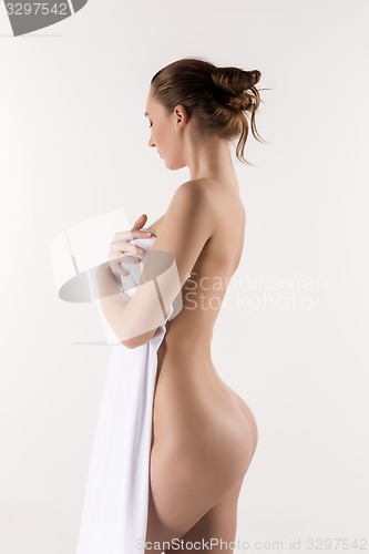 Image of Slim young beautiful girl on the white background