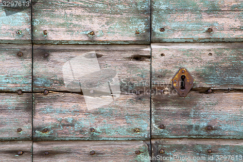 Image of  knocker in a  door curch   wood lombardy   lonate pozzolo