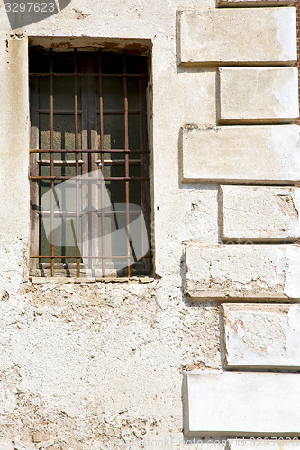 Image of santo antonino w n blind in the concrete  brick