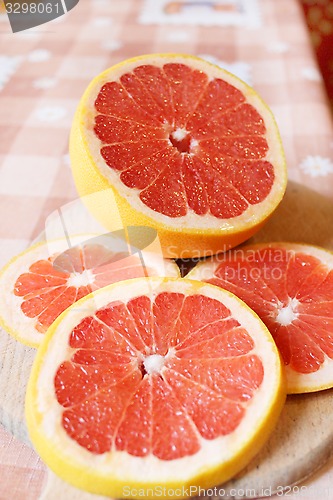 Image of fresh sliced grapefruit on the table