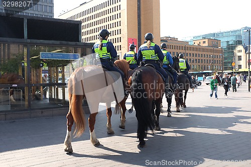 Image of HELSINKI, FINLAND – MAY 21, 2015: Mounted police patrol in the