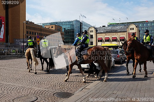 Image of HELSINKI, FINLAND – MAY 21, 2015: Mounted police patrol in the