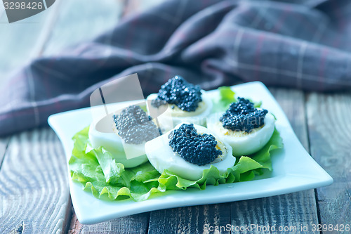 Image of boiled eggs with caviar
