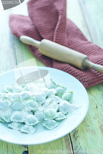 Image of flour and raw ravioli 